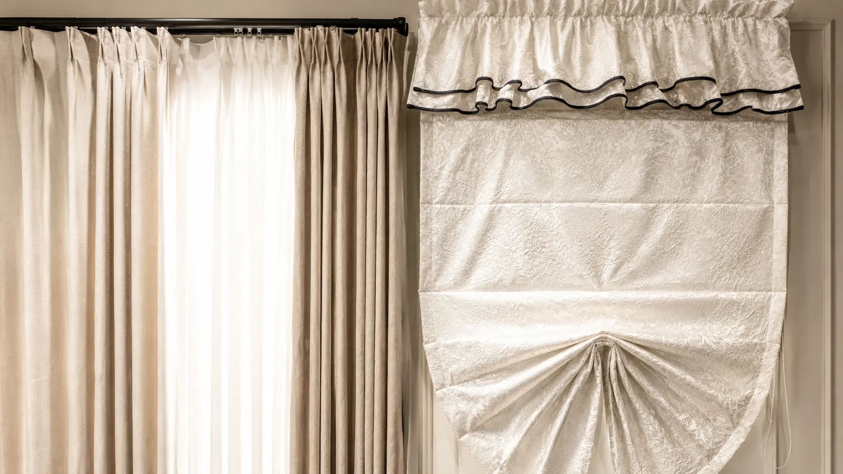 Window finished with full length curtains